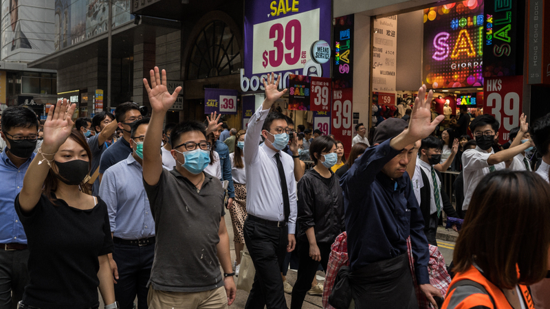 People attend a flash mob rally in the Central district on October 18, 2019 in Hong Kong, China. Anti-government demonstrations in Hong Kong stretched into its fifth month after the Chinese territory’s government invoked emergency powers earlier this month to introduce an anti-mask law.